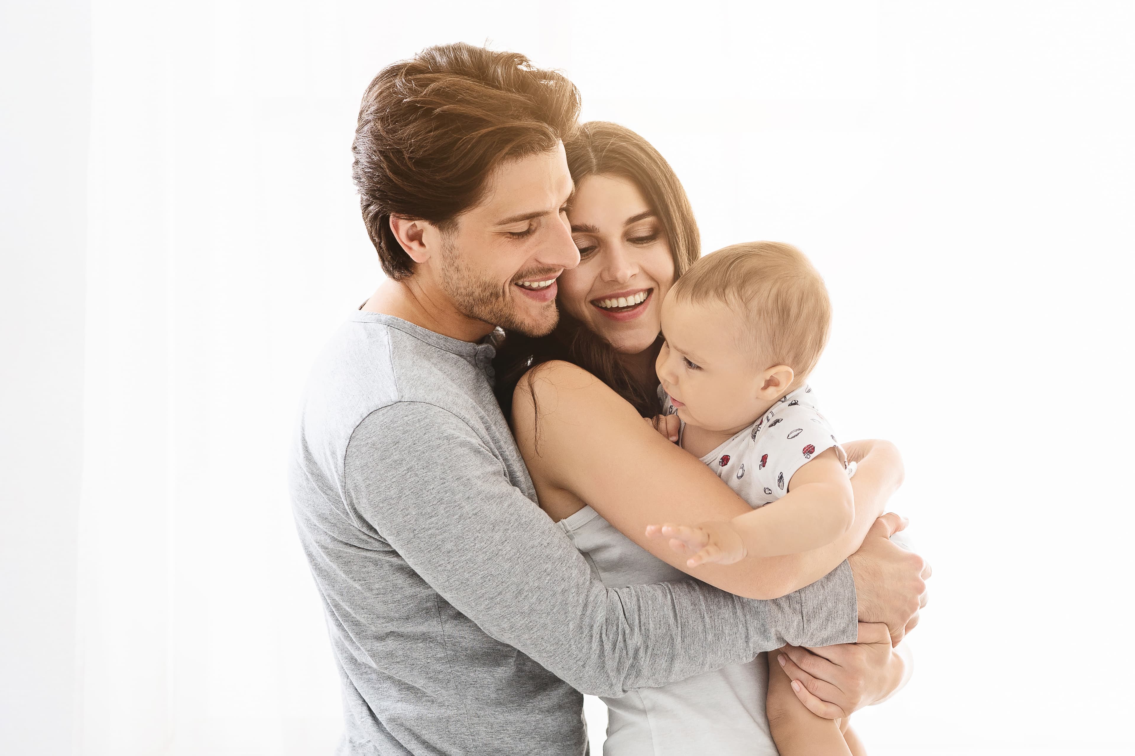 Parents holding their baby together